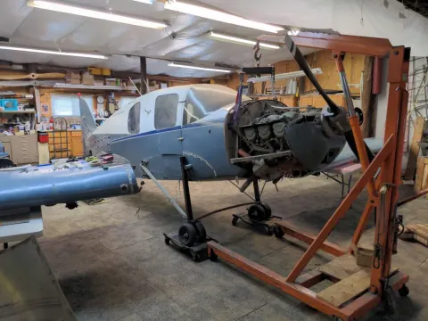 Aircraft on an engine hoist in the shop