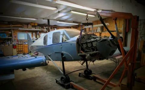 Aircraft on an engine hoist in the shop