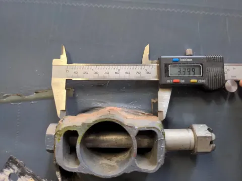 Caliper measuring an aircraft part