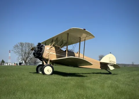 Side profile of 1930 Waco ASO serial 3220, registration NC119Y, on the Brodhead grass