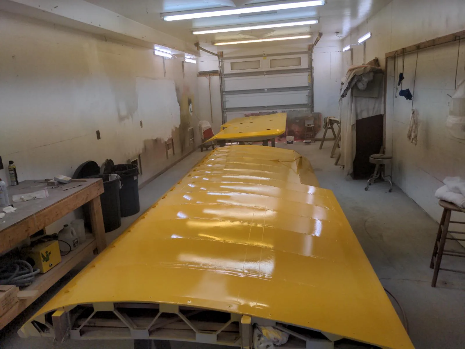 Yellow aircraft wing on a workbench